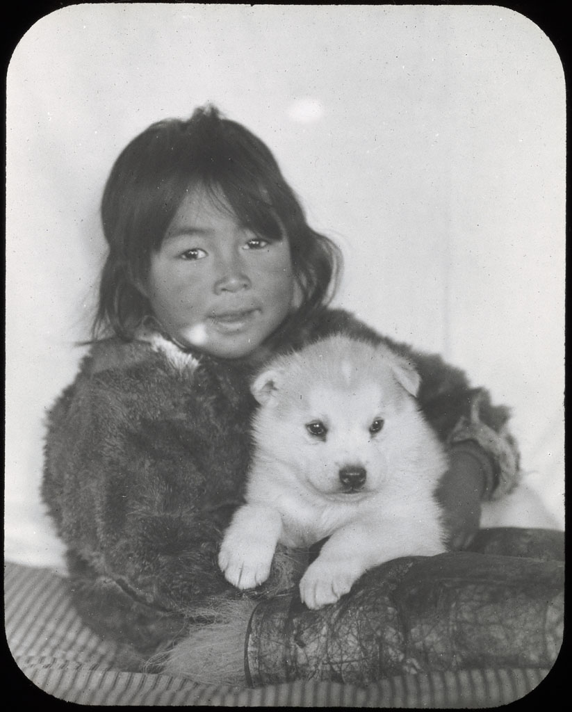 Donald Baxter MacMillan; Shoo-e-ging-wah with White Puppy; 1913-1917; image; silver gelatin on glass; 10.16 cm x 8.26 cm x 0.64 cm (4 in. x 3 1/4 in. x 1/4 in.); TGM; North America