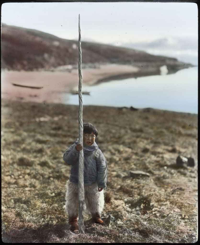 Maynard Owen Williams; Narwhal tooth held upright by young boy ; 1913-1917; image; silver gelatin on glass; 10.16 cm x 8.26 cm x 0.64 cm (4 in. x 3 1/4 in. x 1/4 in.); TGM; North America