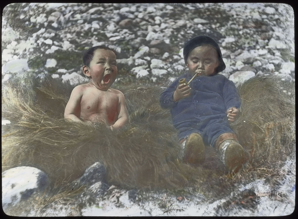 Donald Baxter MacMillan; Boys on muskox skin; 1913-1917; image; silver gelatin on glass; 10.16 cm x 8.26 cm x 0.64 cm (4 in. x 3 1/4 in. x 1/4 in.); TGM; North America