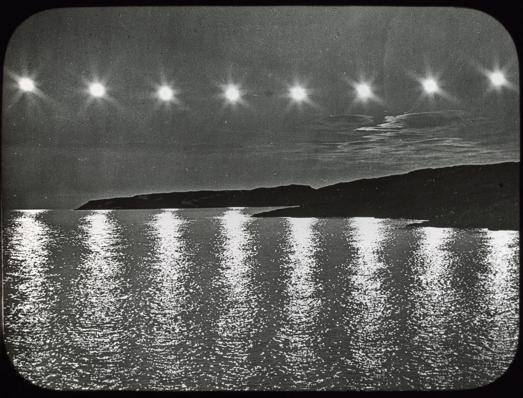 Donald Baxter MacMillan; Eight suns before and after midnight; 1913-1917; image; silver gelatin on glass; 10.16 cm x 8.26 cm x 0.64 cm (4 in. x 3 1/4 in. x 1/4 in.); TGM; North America