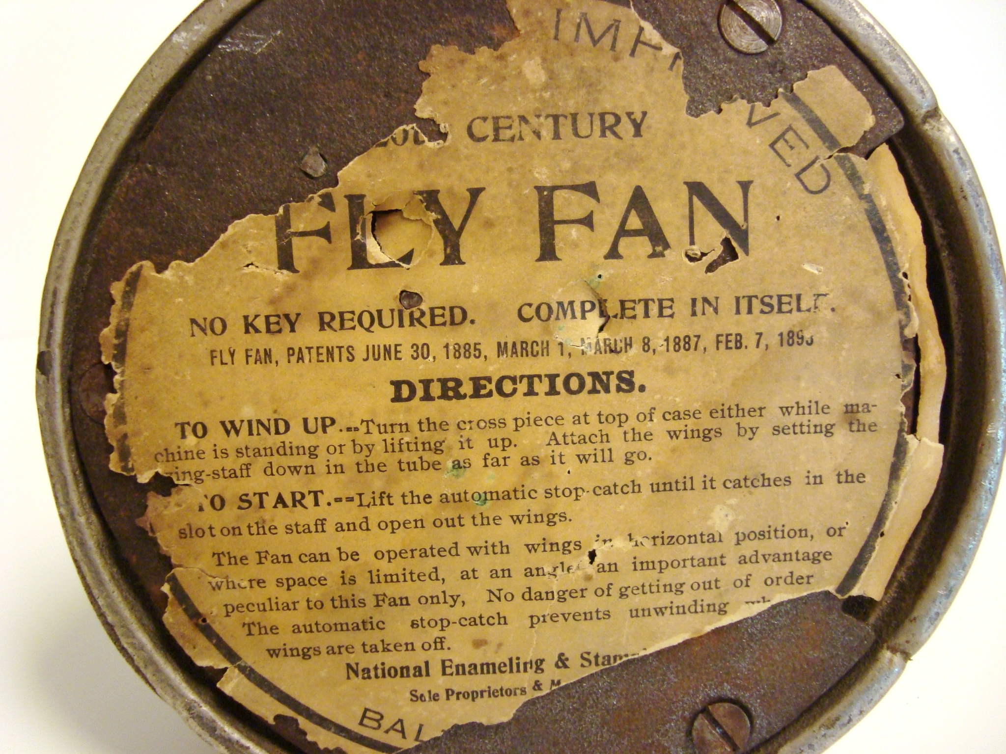 antique fly fan at kitchen table
