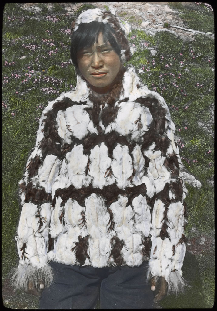 Donald Baxter MacMillan; Ka-ko-tchee-ah wearing shirt of dovekie skins; 1923 - 1924; image; silver gelatin on glass; 10.16 cm x 8.26 cm x 0.64 cm (4 in. x 3 1/4 in. x 1/4 in.); TGM; North America
