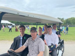 golf Driving Michael Dean's (2022) family after commencement.cart