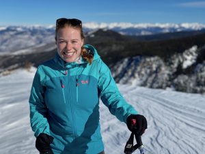 Portrait of Dr. Jacky Baughman, Director of the Bowdoin Emerging Technologies Lab, backcountry skiing in Colorado.